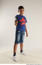 TIMBO STANDING POSE WITH GUN